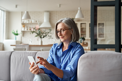 older woman looking at phone