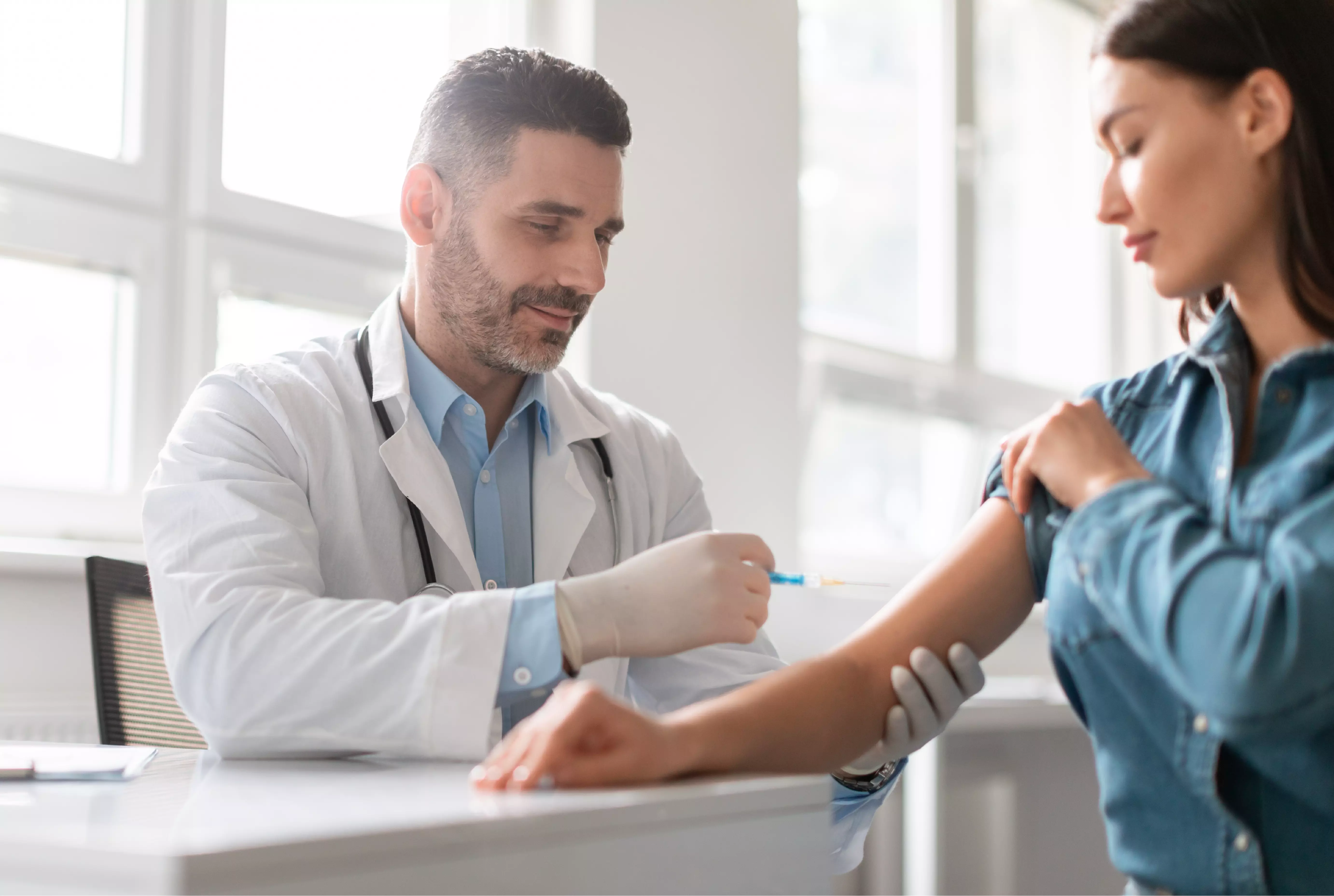 pharmacist administering a vaccine